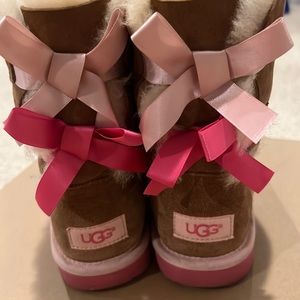 Girls UGG boots with bow.